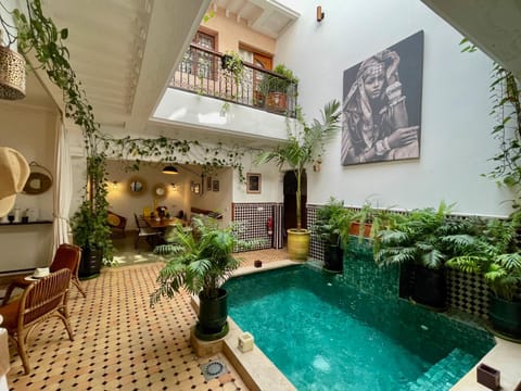 Patio, Seating area, Dining area, Pool view, Swimming pool