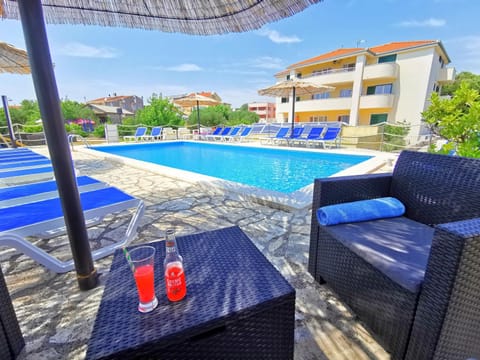 Property building, Pool view, Swimming pool, sunbed