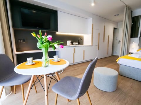 TV and multimedia, Kitchen or kitchenette, Living room, Decorative detail, Seating area, Dining area, microwave, safe, stove, wardrobe