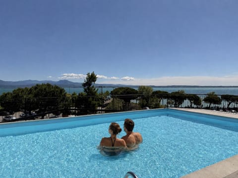 Day, People, Natural landscape, Mountain view, Pool view, Sea view, Swimming pool, group of guests, sunbed