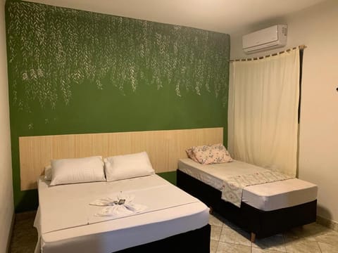 Photo of the whole room, towels, air conditioner