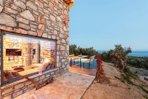 Property building, Natural landscape, View (from property/room), Balcony/Terrace, Living room, Seating area, Sea view