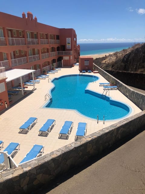 Property building, Day, Beach, Pool view, Sea view, Swimming pool, sunbed
