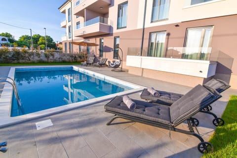 Property building, Pool view, Swimming pool, sunbed