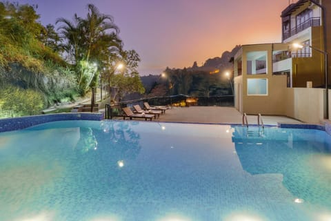 Property building, Patio, Night, Natural landscape, Mountain view, Pool view, Swimming pool, sunbed