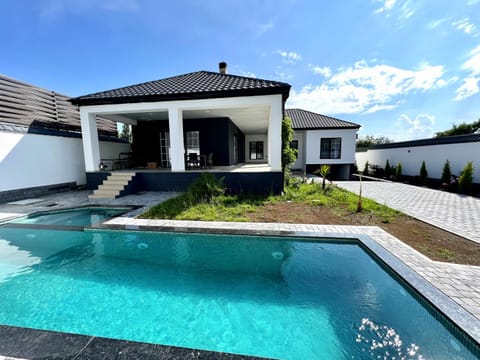 Property building, Patio, Day, Pool view, Swimming pool