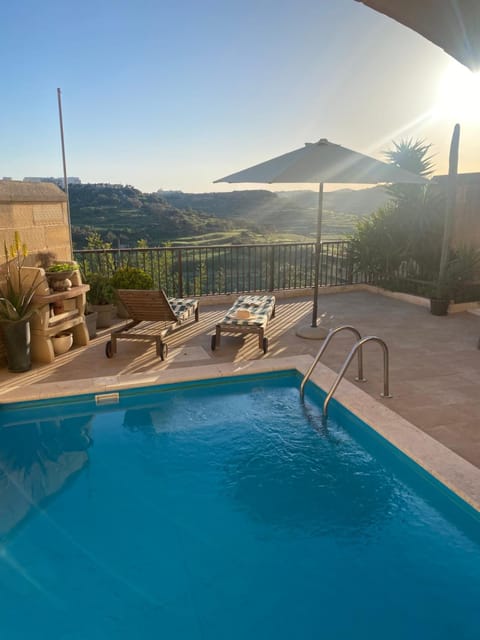 Patio, Day, Natural landscape, Pool view, Swimming pool, sunbed