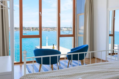Bed, View (from property/room), Seating area, Bedroom, Landmark view, Sea view