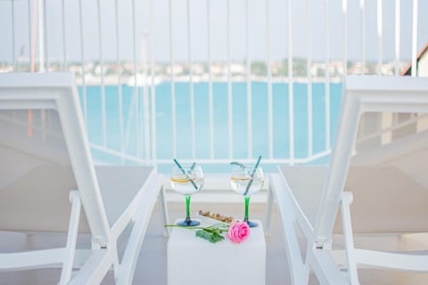 View (from property/room), Balcony/Terrace, Seating area, Beach, Sea view, sunbed