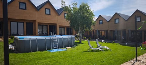 Property building, Garden, Pool view, Swimming pool, sunbed