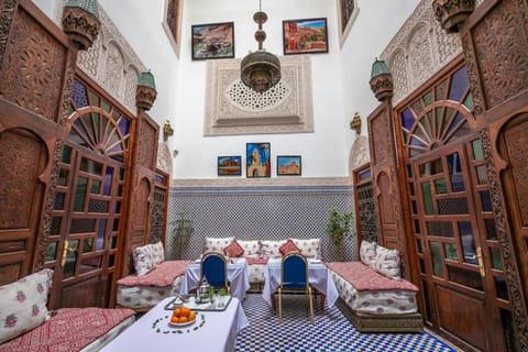 Property building, Restaurant/places to eat, Coffee/tea facilities, Living room, Seating area, Dining area, Lunch, Dinner, VIP