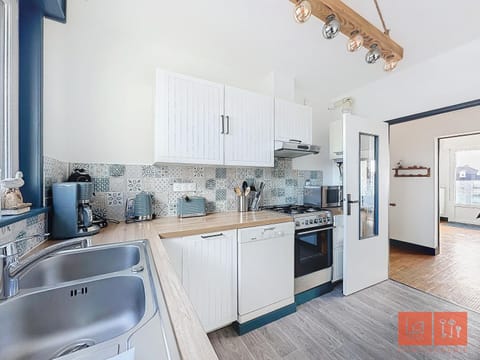 Kitchen or kitchenette, dishwasher, oven, stove, toaster