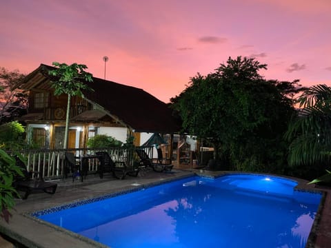 Property building, Natural landscape, Pool view, Swimming pool, Sunset, sunbed