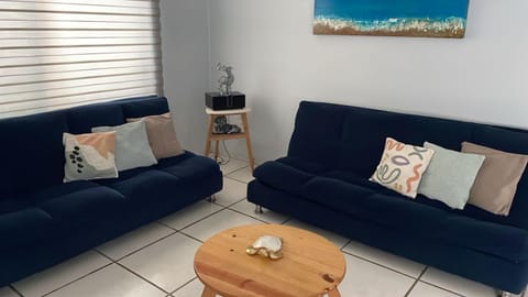 Bed, TV and multimedia, Living room, Seating area, air conditioner