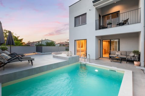 Property building, Swimming pool, Sunset