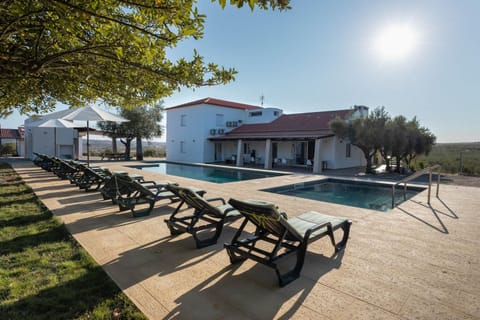 Property building, Natural landscape, Pool view, Swimming pool, sunbed