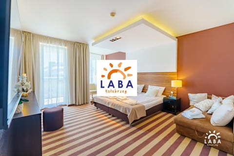 Bed, Property logo or sign, TV and multimedia, Photo of the whole room, Bedroom