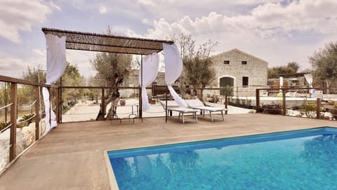 Property building, Patio, Day, Natural landscape, Pool view, Swimming pool, Swimming pool, sunbed