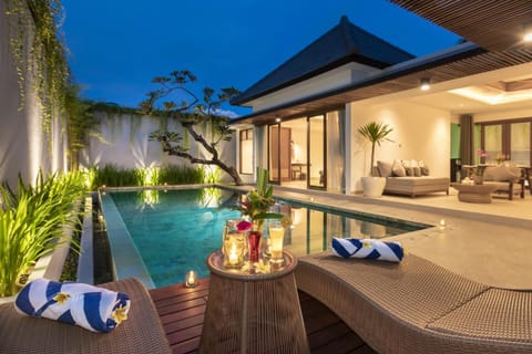 Property building, Patio, Night, Seating area, Pool view, Swimming pool