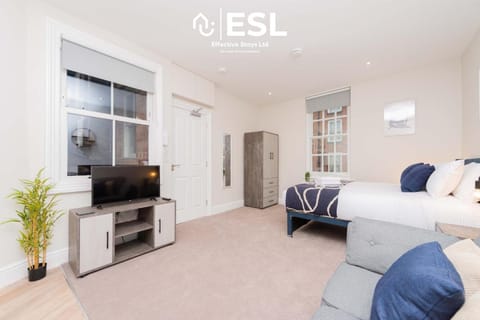 Bed, Seating area, Bedroom, Entertainment