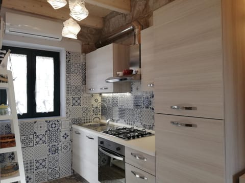 Kitchen or kitchenette, oven, stove