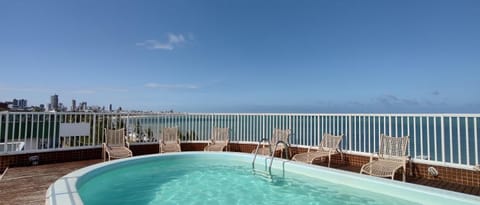 Facade/entrance, Balcony/Terrace, Sea view, Swimming pool