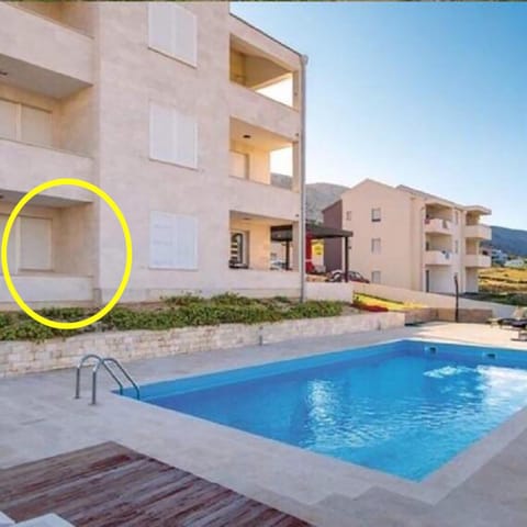 Property building, Patio, Pool view, Swimming pool, sunbed
