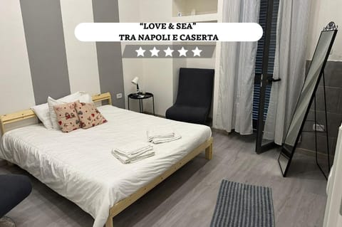 Bed, Photo of the whole room, Bedroom, Text overlay, towels, wardrobe