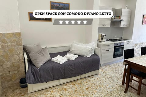 Bed, TV and multimedia, Kitchen or kitchenette, Living room, Photo of the whole room, Seating area, Text overlay, pet friendly, towels