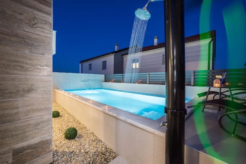 Patio, Night, Pool view, Swimming pool, sunbed