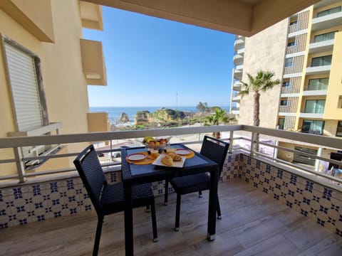 Property building, Day, Natural landscape, View (from property/room), Balcony/Terrace, Food and drinks, Dining area, Food, Sea view