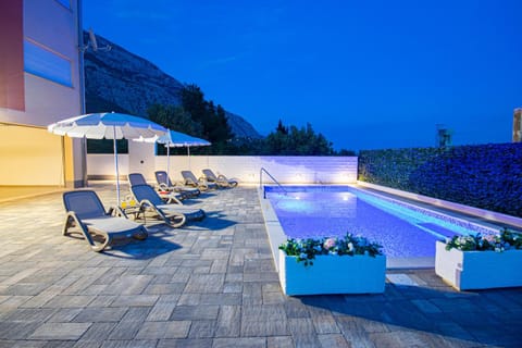 Patio, Night, Natural landscape, Pool view, Swimming pool, sunbed