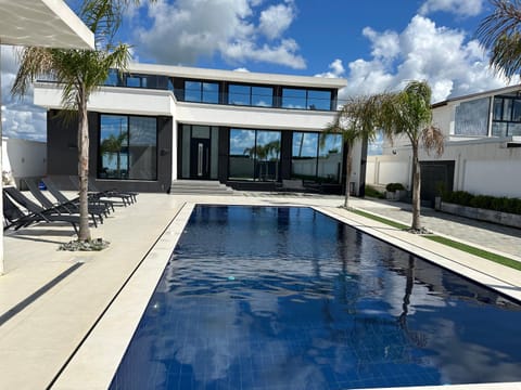 Property building, Day, Pool view, Swimming pool, sunbed