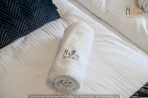 Bed, Property logo or sign, Bedroom