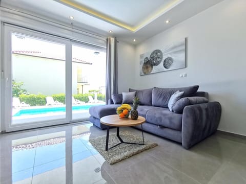 Living room, Seating area, Pool view, Swimming pool, sunbed