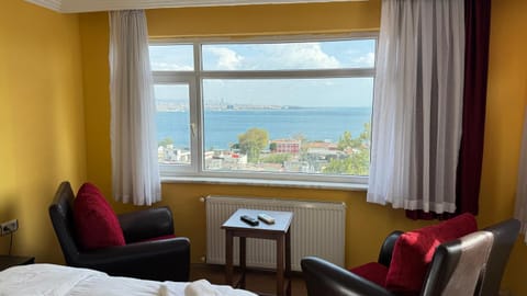 View (from property/room), Seating area, Bedroom, Sea view