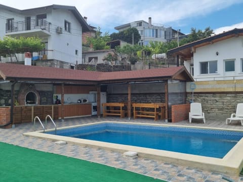 Property building, Patio, Pool view, Swimming pool, locker, sunbed