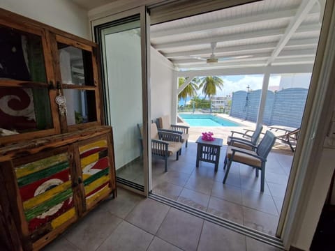 Patio, Living room, Seating area, Pool view, Swimming pool