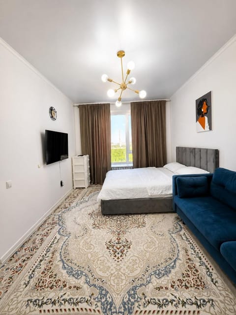 Communal lounge/ TV room, Bed, TV and multimedia, Living room, Photo of the whole room, Seating area, Bedroom
