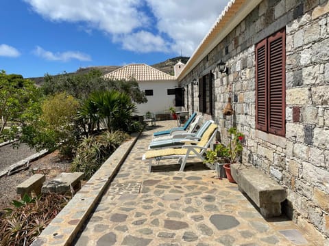 Property building, Patio, Natural landscape, Mountain view, sunbed