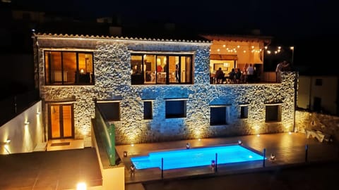 Property building, Patio, Night, Pool view, Swimming pool