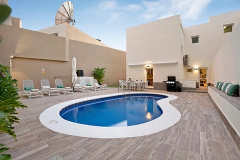 Property building, Living room, Swimming pool
