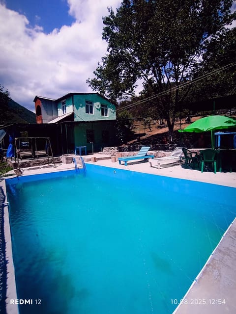 Property building, Day, Natural landscape, Mountain view, Pool view, Swimming pool, sunbed