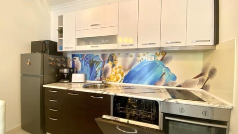 Kitchen or kitchenette, dishwasher, microwave, oven, stove