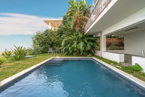 Property building, Living room, Swimming pool