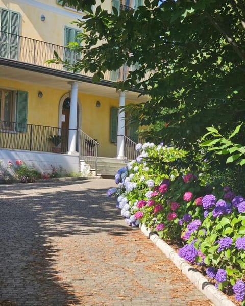 The Ortensia, our Room with Lake View, Spacious Park-Facing Balcony and Private External Bathroom at the Villa Isabella Stresa Bed and Breakfast in Stresa