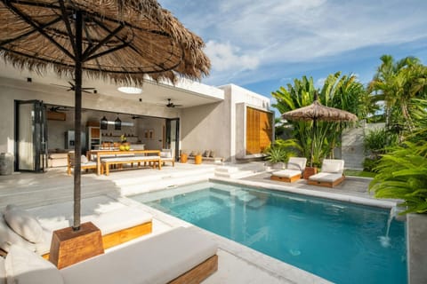 Property building, Patio, Pool view, Swimming pool, sunbed