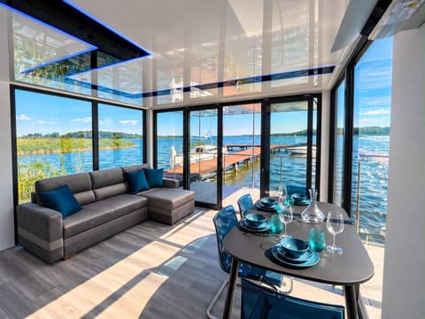 Activities, View (from property/room), Living room, Seating area, Dining area, Lake view