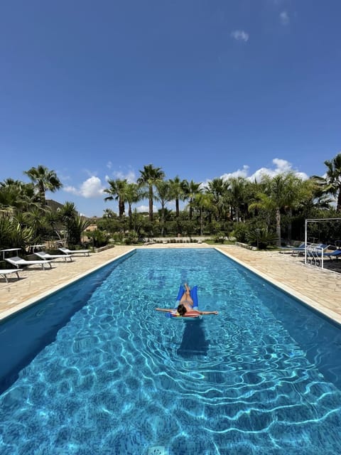 Day, People, Natural landscape, Pool view, Swimming pool, sunbed