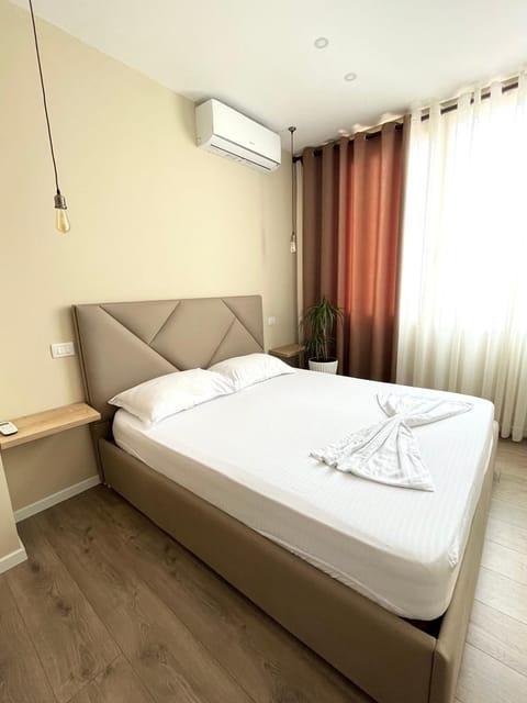 Bed, Photo of the whole room, Bedroom, towels, air conditioner